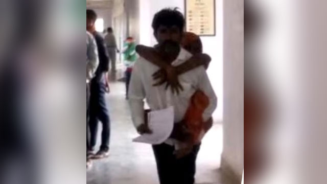 దివ్యాంగురాలైన భార్యను వీపుపై మోస్తూ కలెక్టరేట్‌కు.. పదేళ్ల అధికారుల నిర్లక్ష్యానికి సాక్ష్యం!